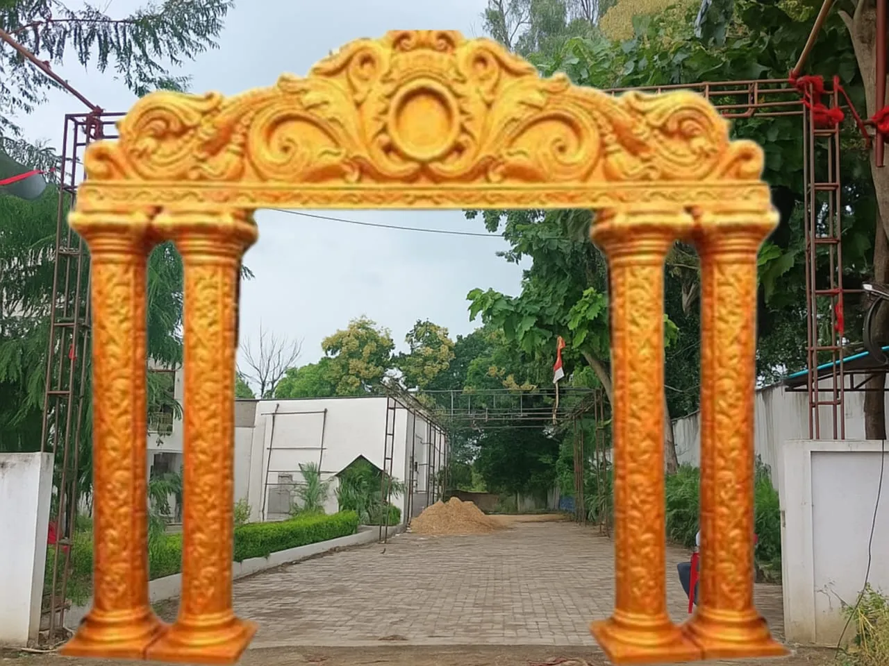 Golden carved entrance arch installed at a venue gate in Varanasi
