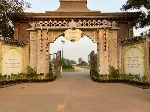 Ornate event venue entrance gate with planters in Varanasi