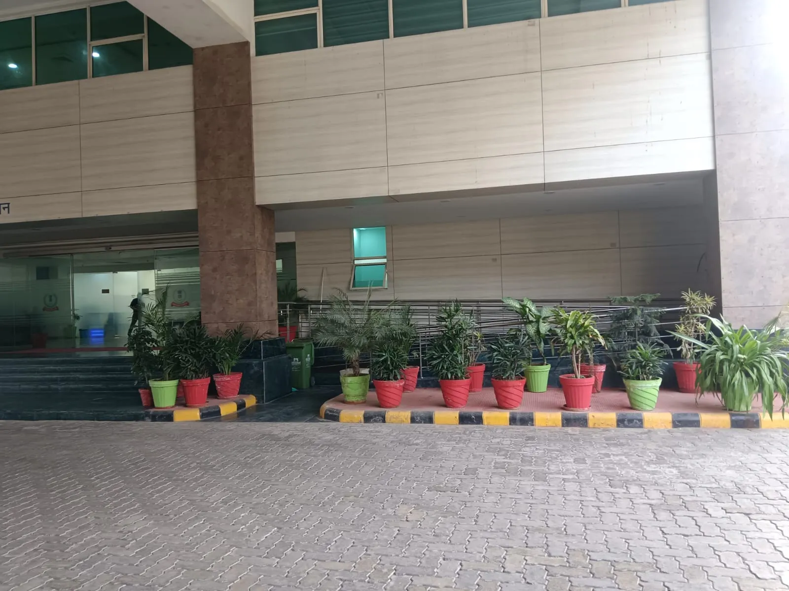 Potted plants lining the entrance of Pratyaksh Kar Bhawan, Lucknow