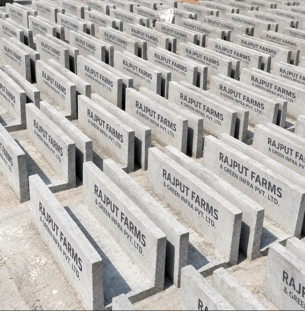 Illustration of precast RCC drain channels stacked in a casting yard