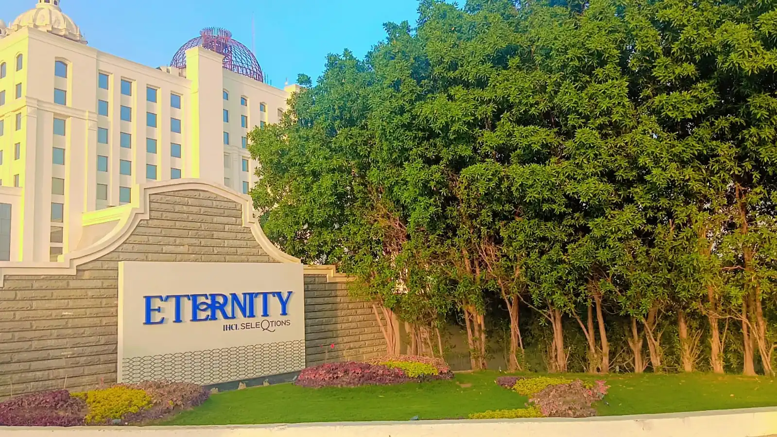 Eternity IHCL SeleQtions entrance with ficus hedge and hotel landscaping